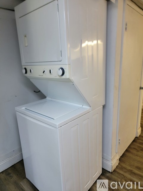 A white oven and stove top are in a kitchen.