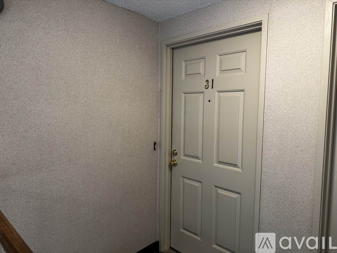 A white door with the number 31 on it.