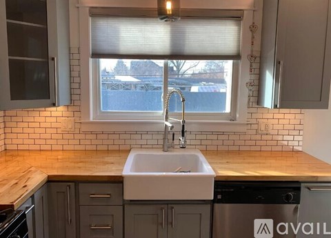 A kitchen with a sink and a window.