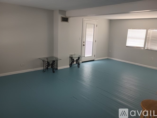 A room with a table and chairs in it.