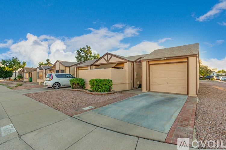 A house with a garage is for sale.