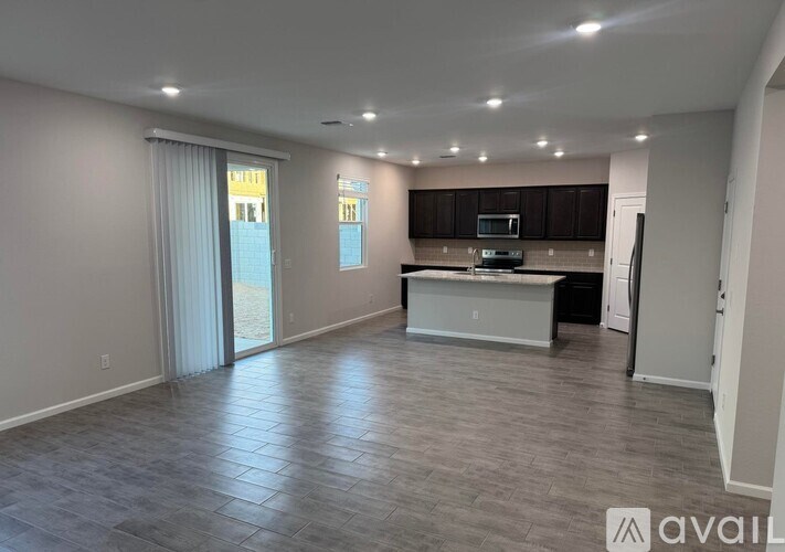 A bedroom with a bed, dresser, and mirror.