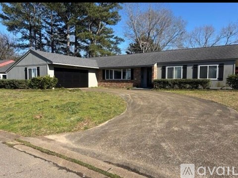 A house with a driveway in front of it.