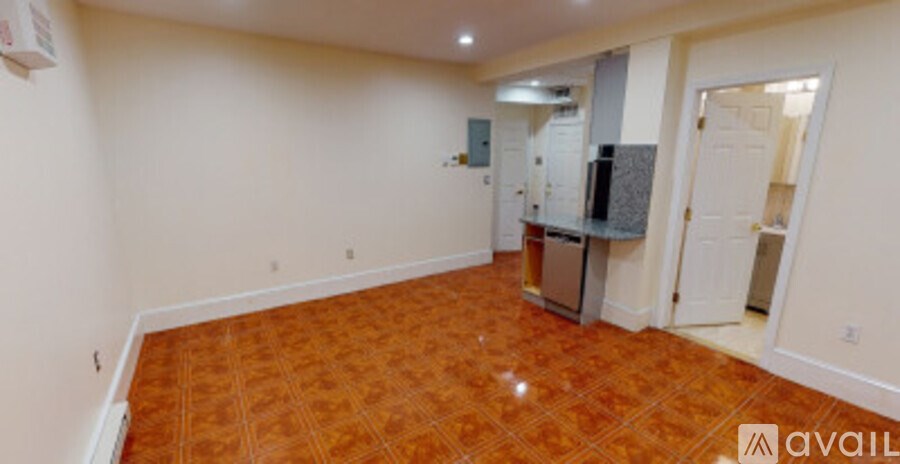 A room with a tile floor and white walls.