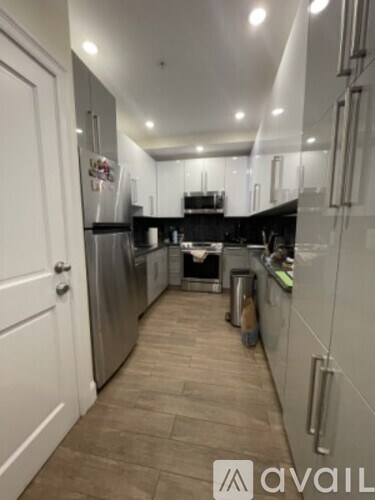 A kitchen with a white door and a counter.