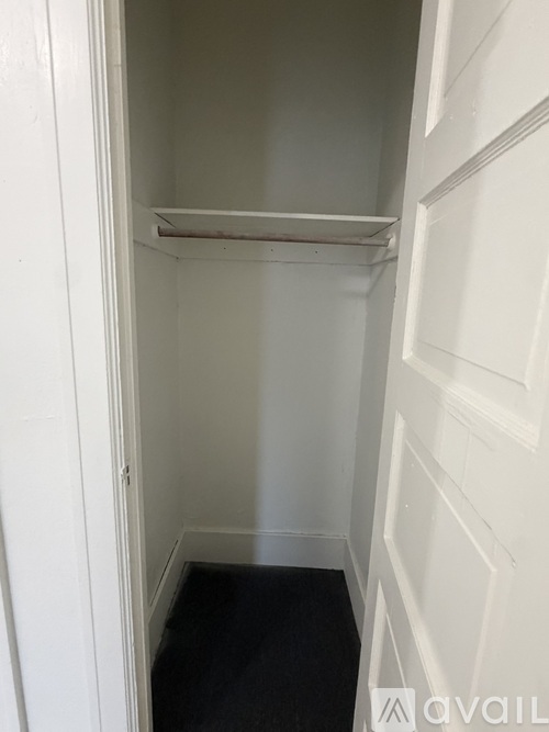 A white door with a shelf and Avail logo.