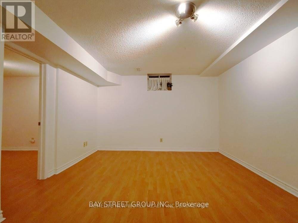 A room with wooden floors and white walls.