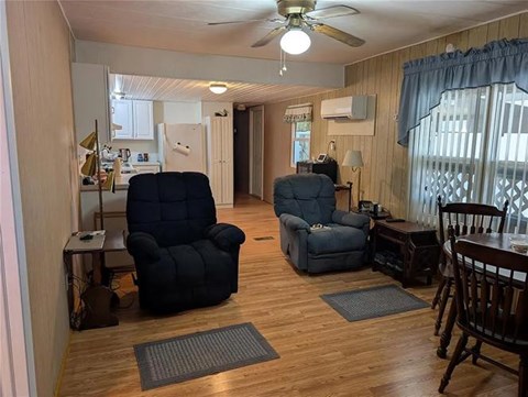A living room with two chairs and a table.