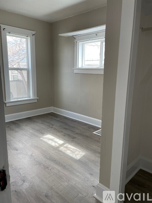 A room with a window and a door.