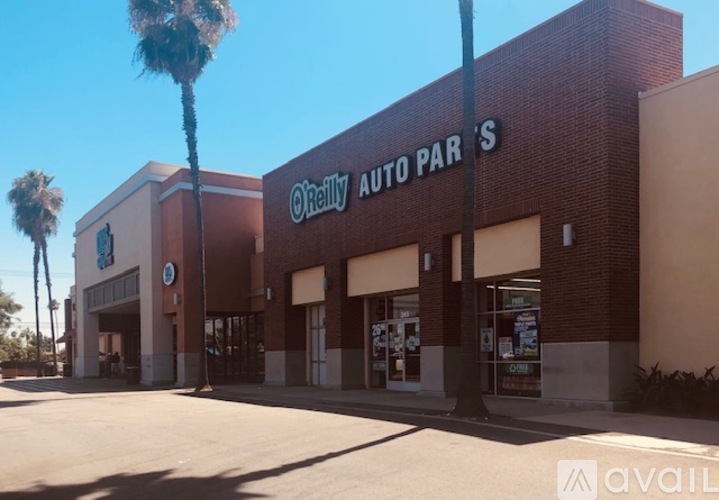 A car dealership with a sign that says "Reilly Auto Parts".