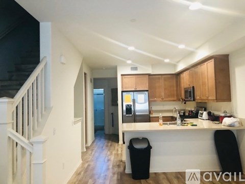 A kitchen with wooden cabinets and a white countertop.