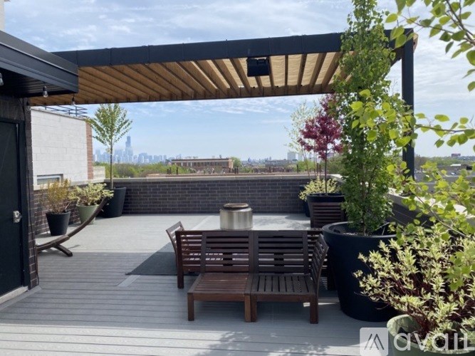 A patio with a table and chairs under a roof.