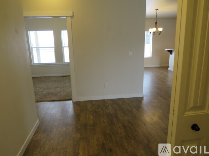 A room with wooden floors and white walls.