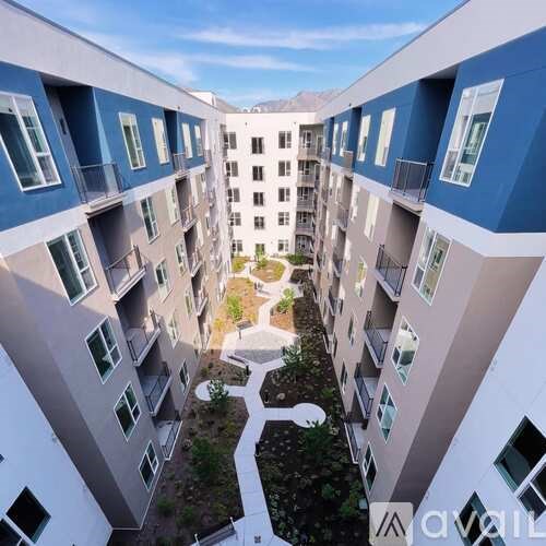 A view of a courtyard from an apartment balcony.