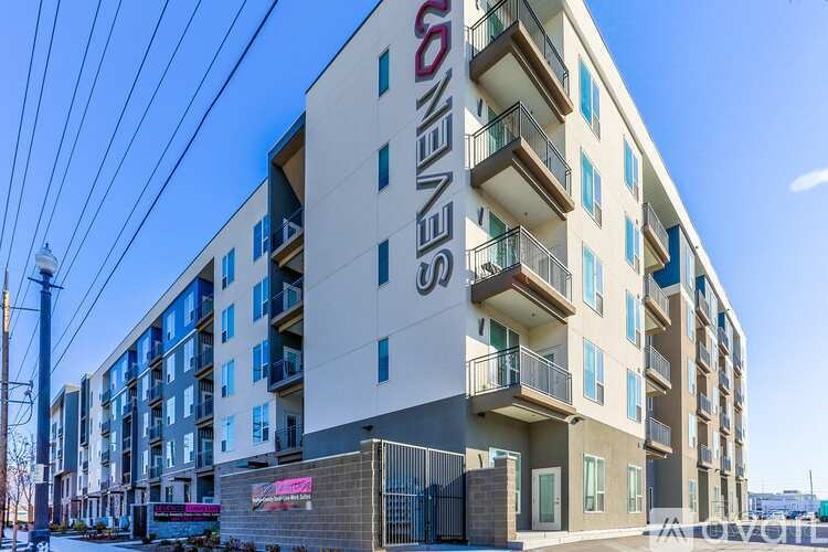 A multi-story building with the name "Seven Seas" on the side.