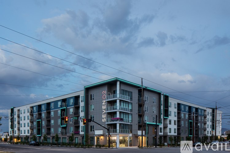 A modern multi-story building with the name "SEVEN O2" on the side.