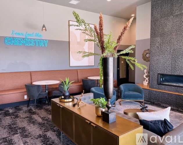 A room with a neon sign that says "I love the CHEMISTRY" on the wall.