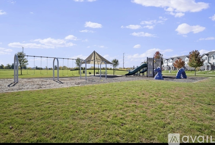 A playground with a swing set and a slide.