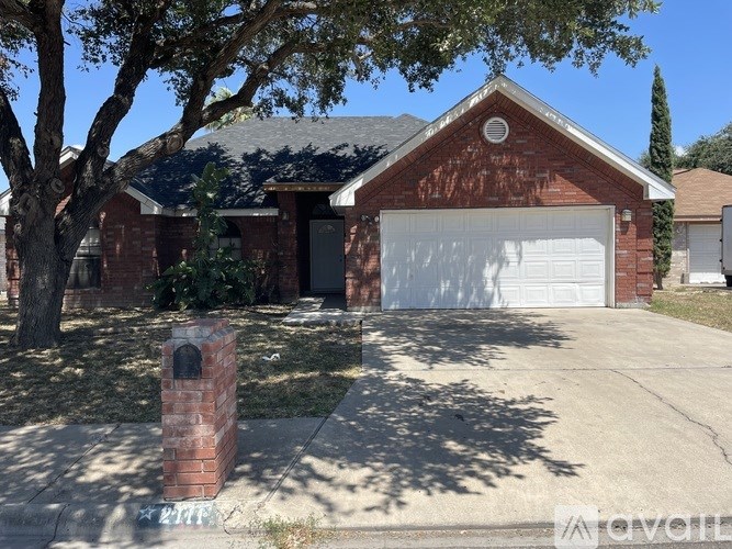 A red brick house with a white garage door.