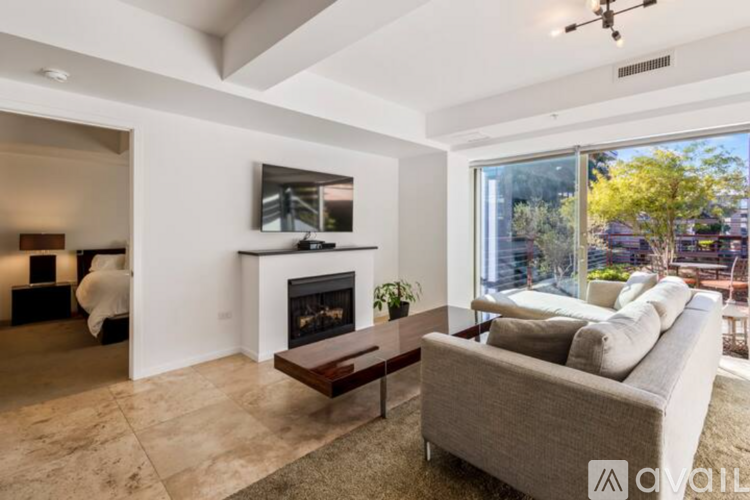 A modern living room with a fireplace and a couch.