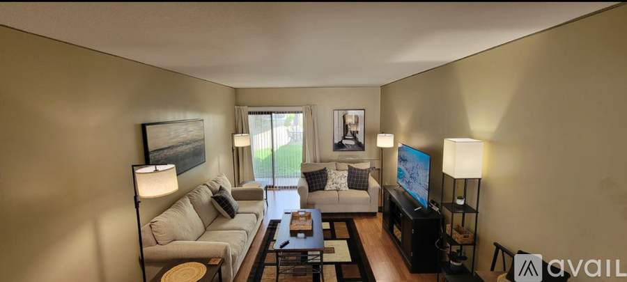 A small room with a black mat on the floor.
