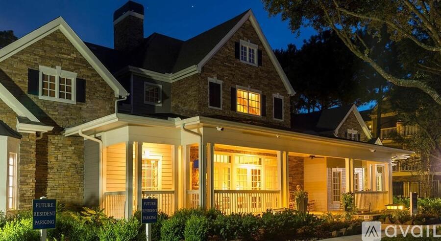 A house with a sign that says "Future Estate Agents" in front of it.