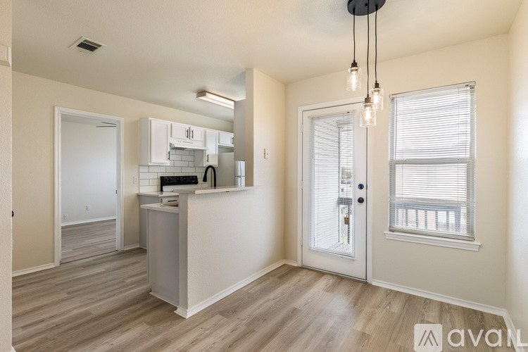 A kitchen area with a counter and cabinets.