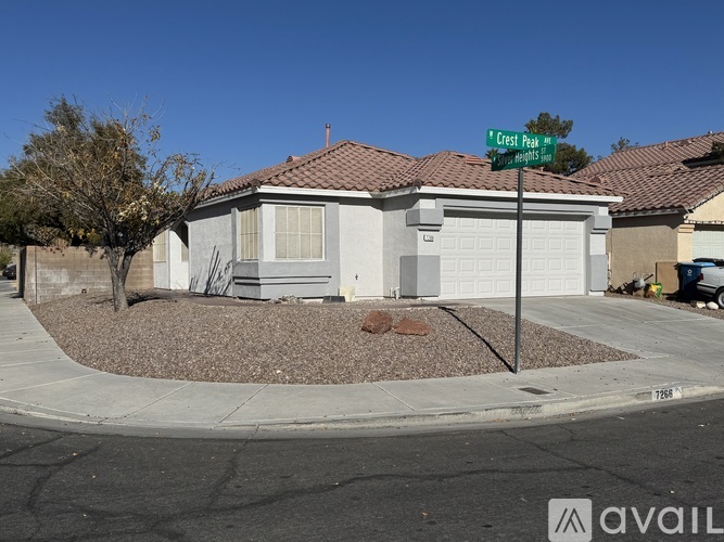 A house with a sign that says Crest Peak Lane.
