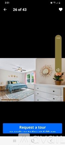 A room with a bed, dresser, and ceiling fan.