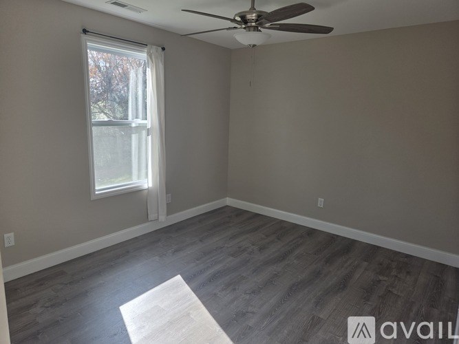A kitchen with a granite countertop and stainless steel appliances.