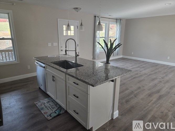 A room with a long table and chairs is shown with a "Request a tour" button.