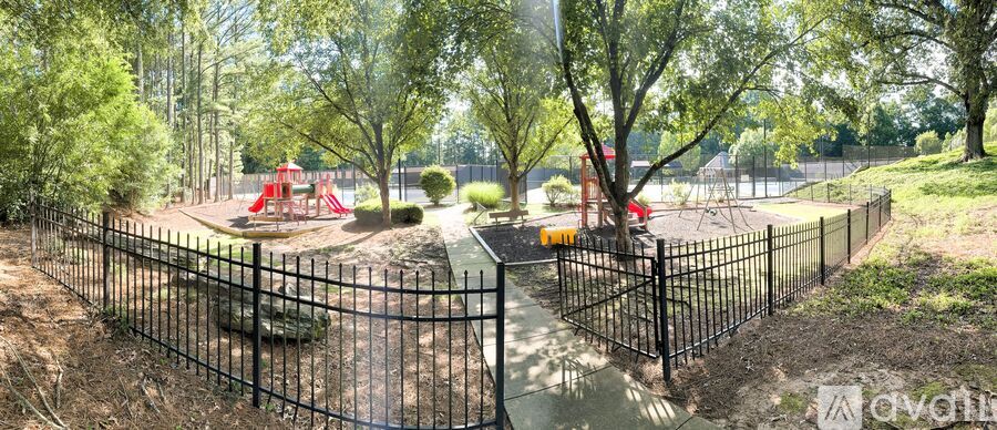 A playground with a swing set and a slide.