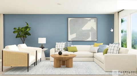 A living room with a white sofa, a wooden coffee table, and a large abstract painting on the wall.