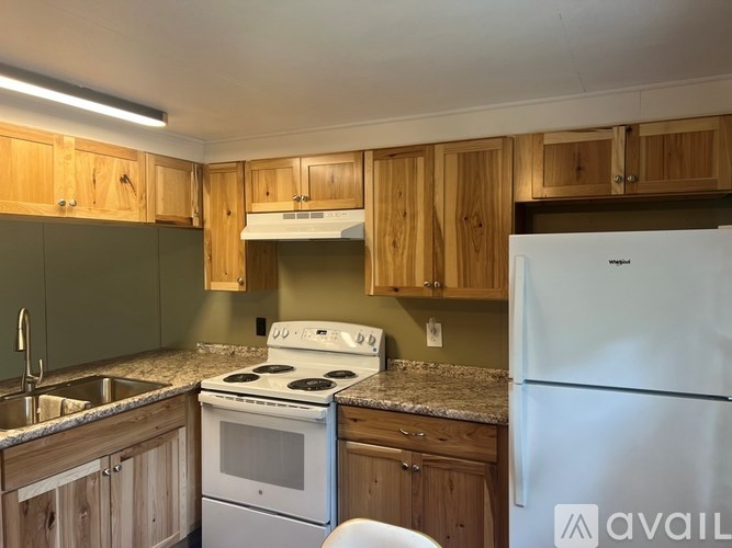 A room with a wooden floor and a glass door.