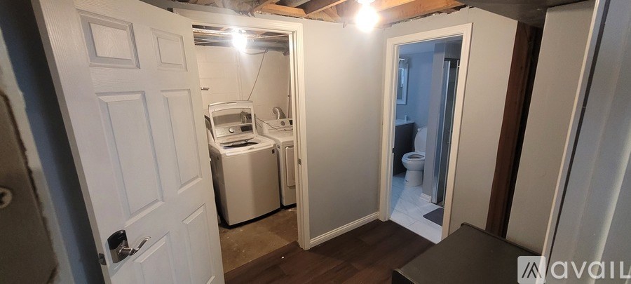 A small room with a washer and dryer in it.
