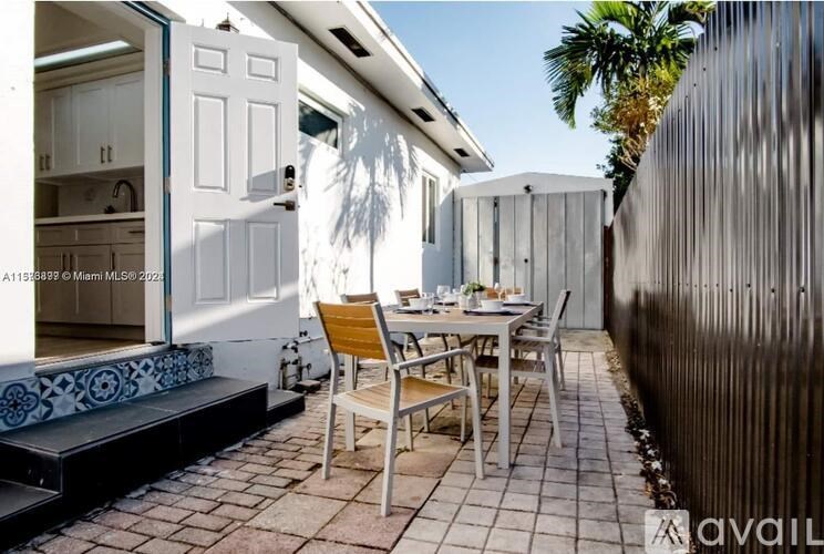 A patio with a table and chairs is shown.