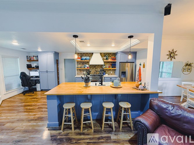 A kitchen with a bar area and a couch.