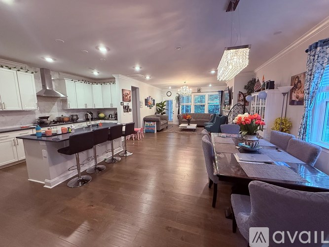 A well-lit kitchen and dining area with modern furnishings.