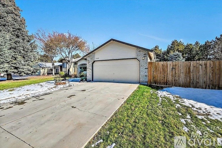A detached house with a garage and a driveway.