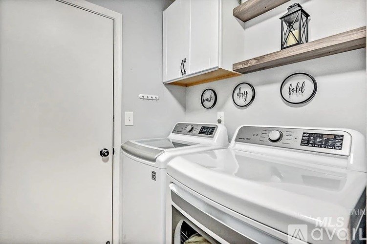 A white oven and dishwasher in a kitchen.