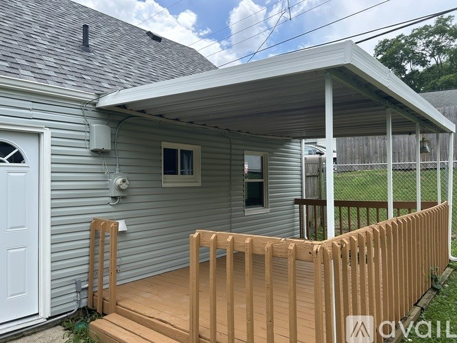 A house with a grey roof and a white door.