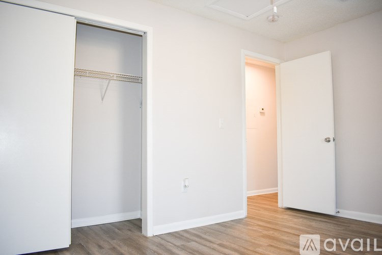 A kitchen with dark brown cabinets and a white refrigerator.