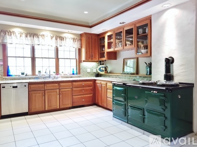 A room with a table and chairs in it.