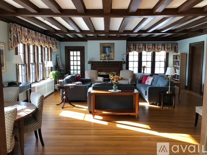 A living room with wooden floors and furniture.