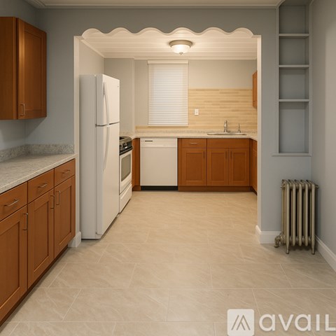 A kitchen with white appliances and wooden cabinets.