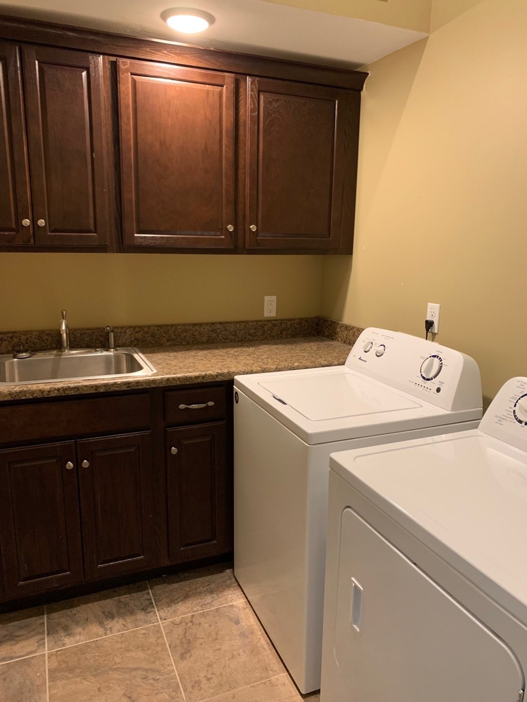 A laundry room with a washer and dryer.