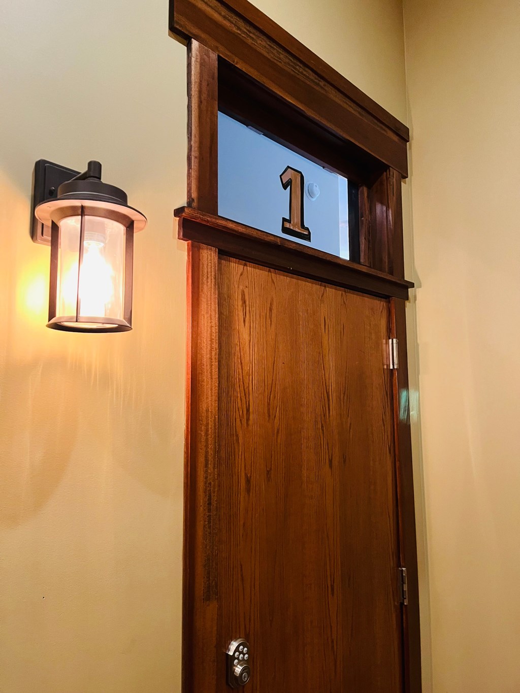 A wooden door with a number 1 on it.