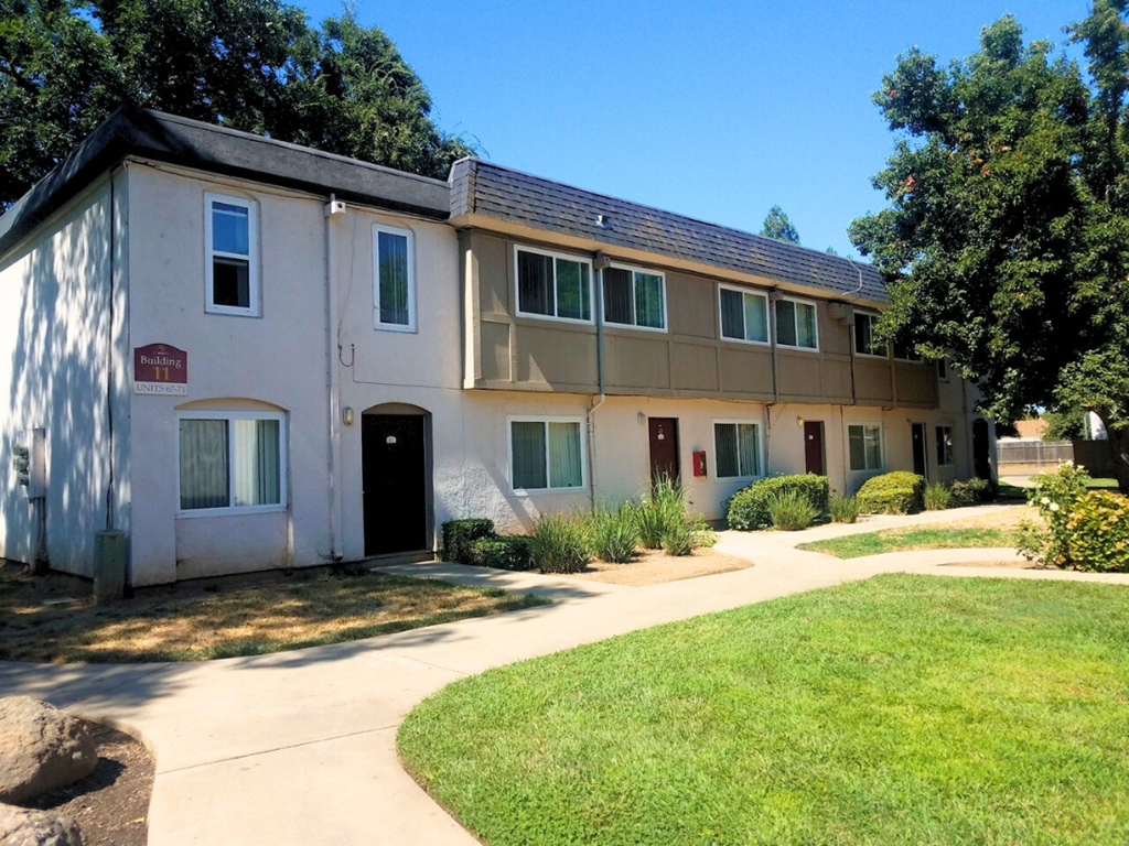 A building with a red sign on the front door.