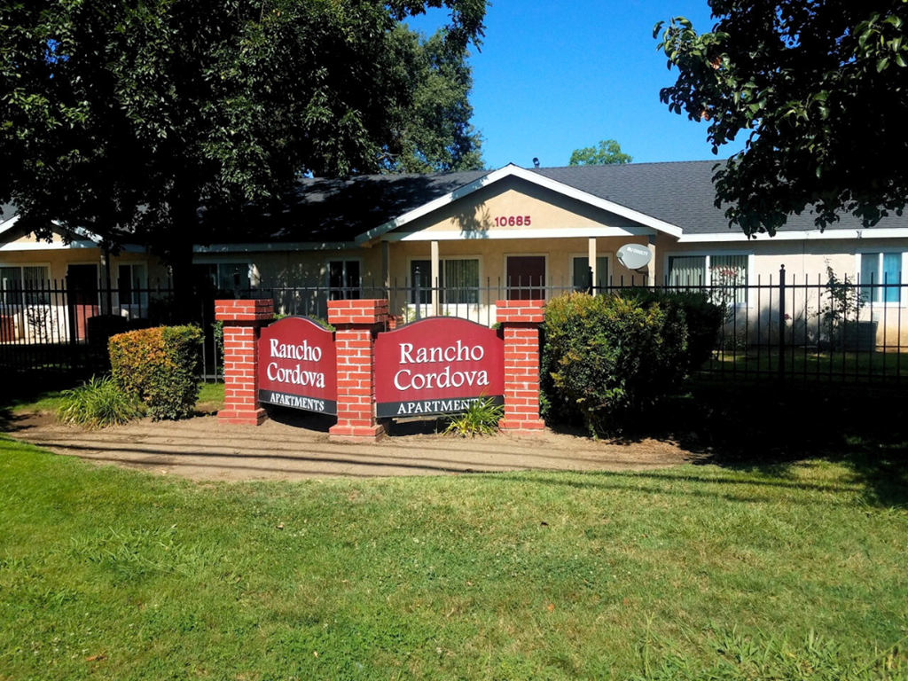 The image shows a house with a sign that reads "Kancho Cordova Apartments".