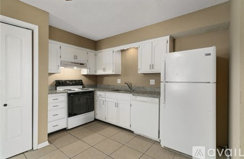 A kitchen with white appliances and cabinets.